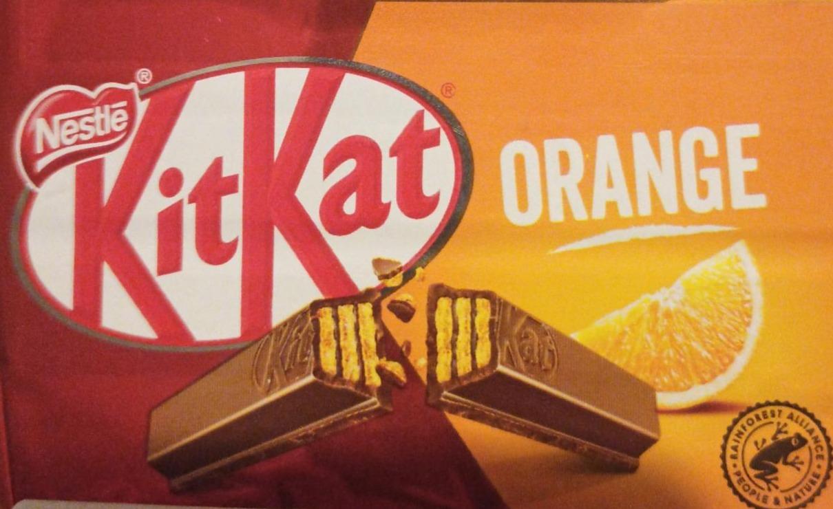 Фото - Вафельні палички в молочному шоколаді з апельсиновим смаком Orange Kit Kat