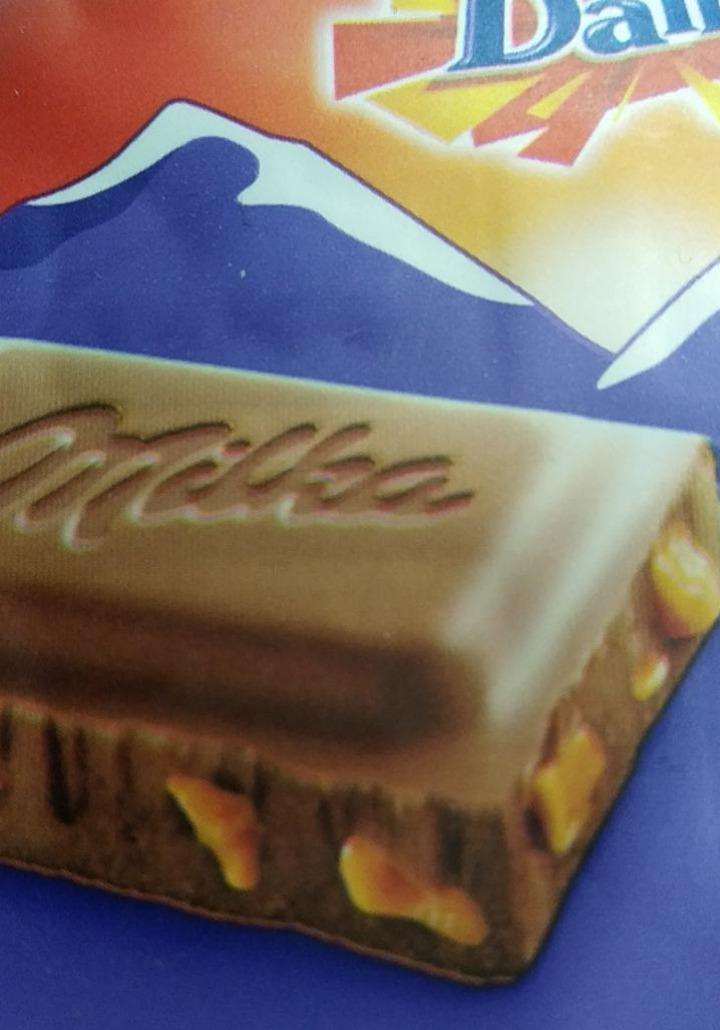 Фото - Шоколад молочний зі шматочками хрумкої карамелі з мигдалем Milka