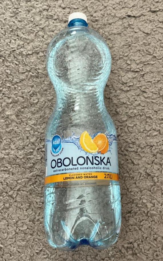 Фото - Напій безалкогольний сильногазований зі смаком лимона та апельсина Оболонська