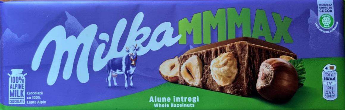 Фото - Шоколад молочний з альпійського молока та цілими лісовими горіхами Milką