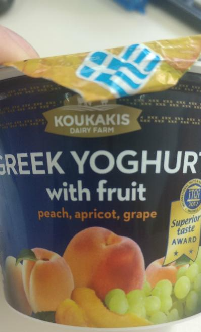 Фото - грецький йогурт з фруктовим наповнювачем персик, абрикос, виноград Koukakis