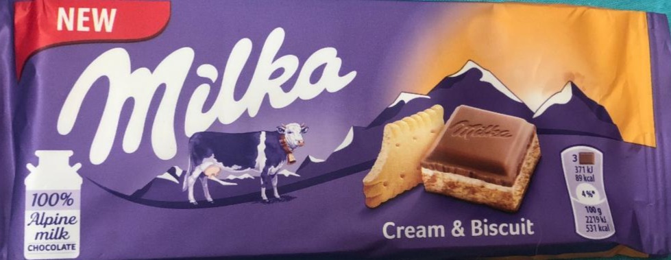 Фото - Молочний шоколад Milka з кремом і бісквітом Milka