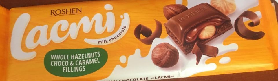 Фото - Шоколад молочний з цільними лісовими горіхами, карамеллю і шоколадною начинкою Lacmi Roshen