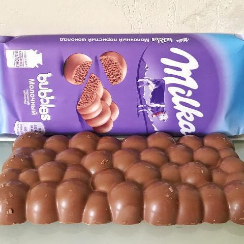 Фото - шоколад молочний пористий Milka Bubbles
