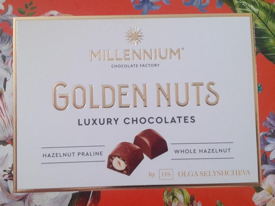 Фото - Цукерки шоколадні з начинкою та цілими горіхами Golden Nut Millennium